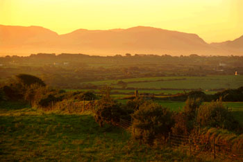 Sunrise over mountain by Paul Mattock